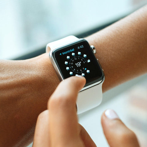 Woman looking at an apple watch