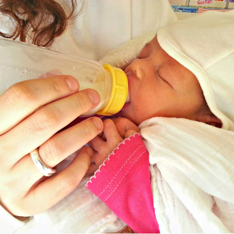 Baby feeding from a bottle