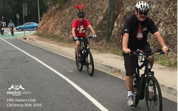 Two men riding up a hill | Electric Bikes Brisbane