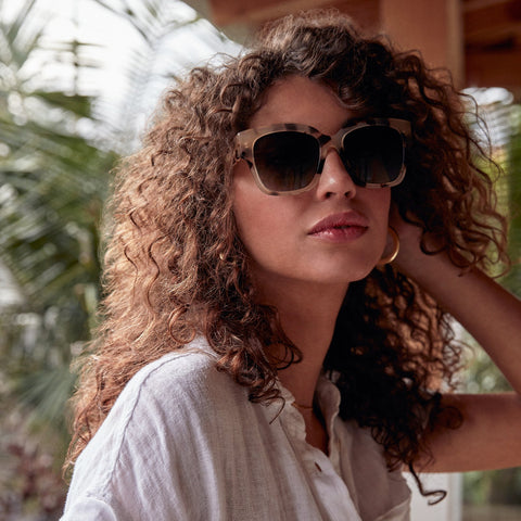 Bella 2 sunglasses in cream tortoise frames with grey gradient lens on a female model