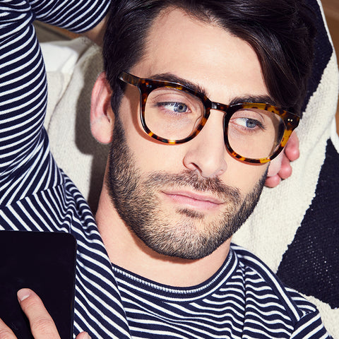 Weston eyeglasses with amber tortoise frames and prescription lens on a male model