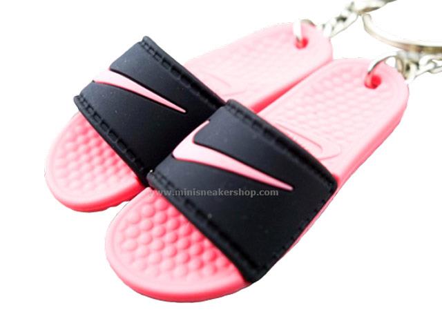 pink and black nike flip flops