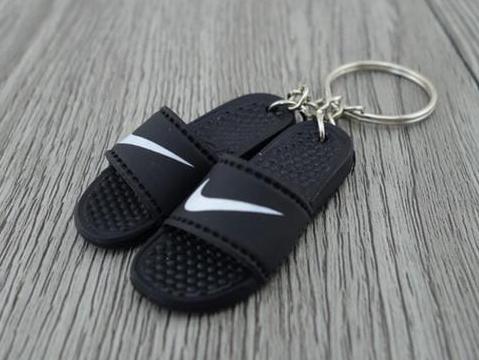 nike swoosh flip flops