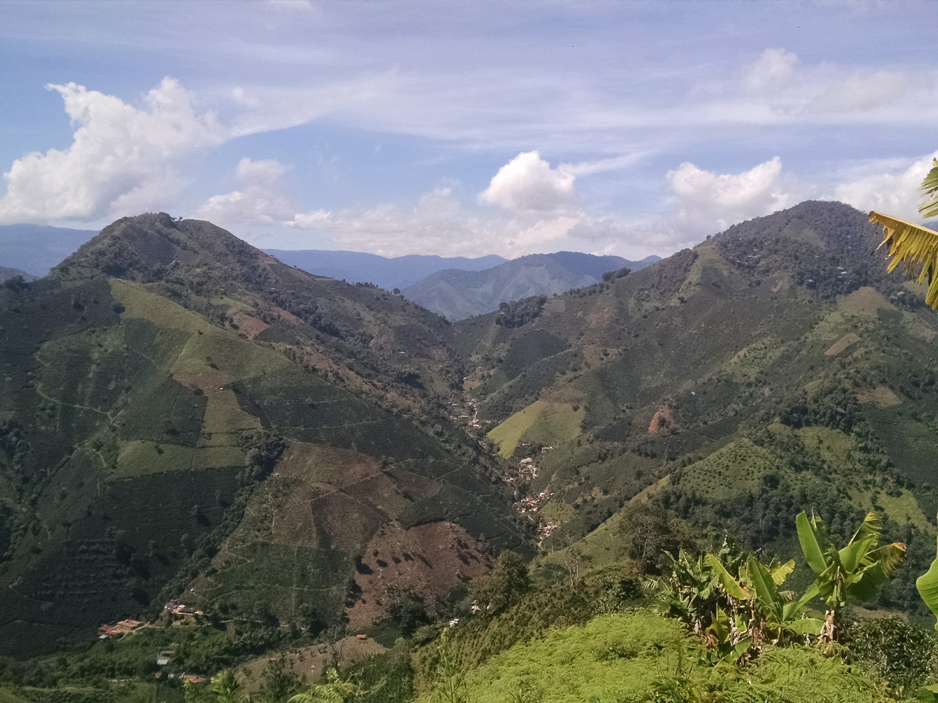 relatives of Gozalo's in valley in which some help on his farm. Photo taken from his farm at elevation of 6,100' above sea level.