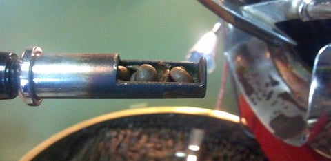 FosterHobbs Coffee Roaster Uses Trowel  to Sample Beans During Roast 
