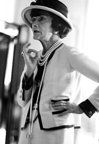 photo of coco chanel wearing white suit
