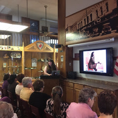 Mary Perisho presenting a modern quilting presentation at the Northwest Arkansas Modern Quilt Guild meeting