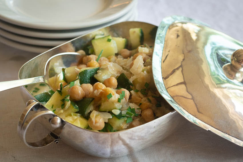 Rancho Gordo cooked Garbanzo Beans with zucchini and yogurt in a silver dish