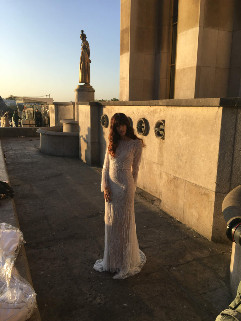 Our photographer shooting the model standing in a wedding dress at Tracadaro in Paris.