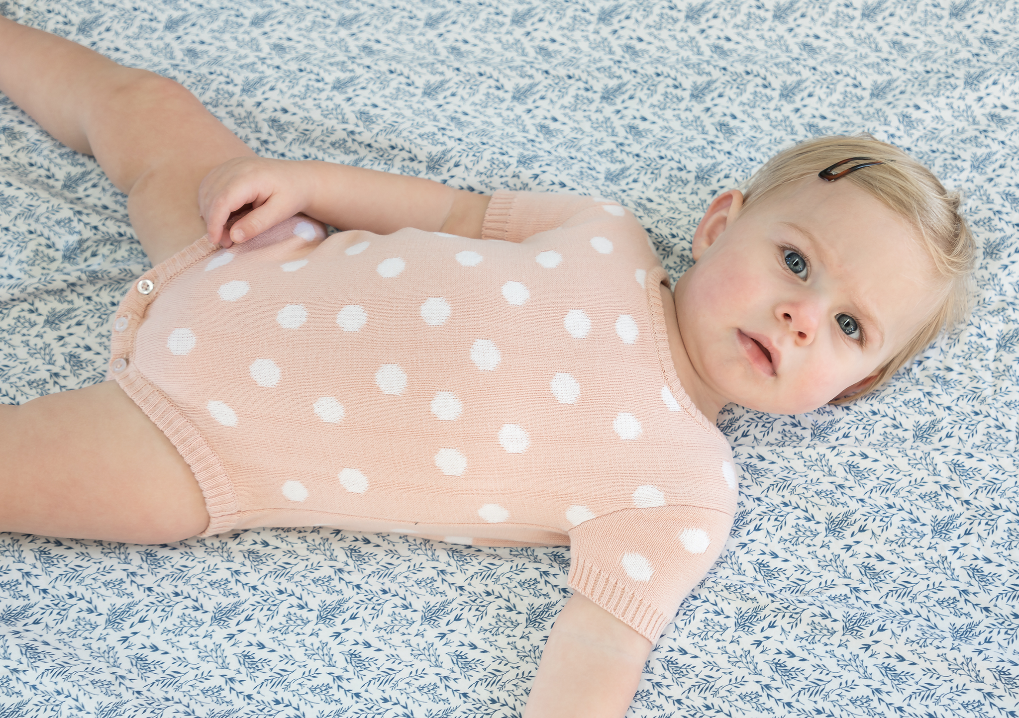 pink and white spot body suit