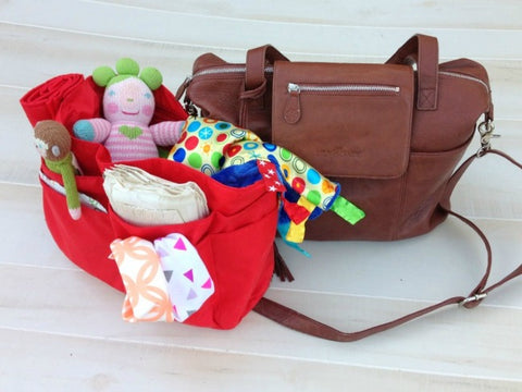 Baby Jack Lovey inside Lily Jade Diaper Bag