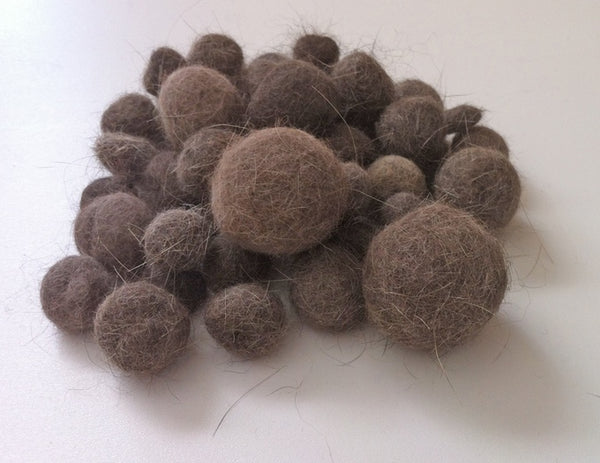 Cat fur balls extracted by the CoatHook Undercoat Pet Comb