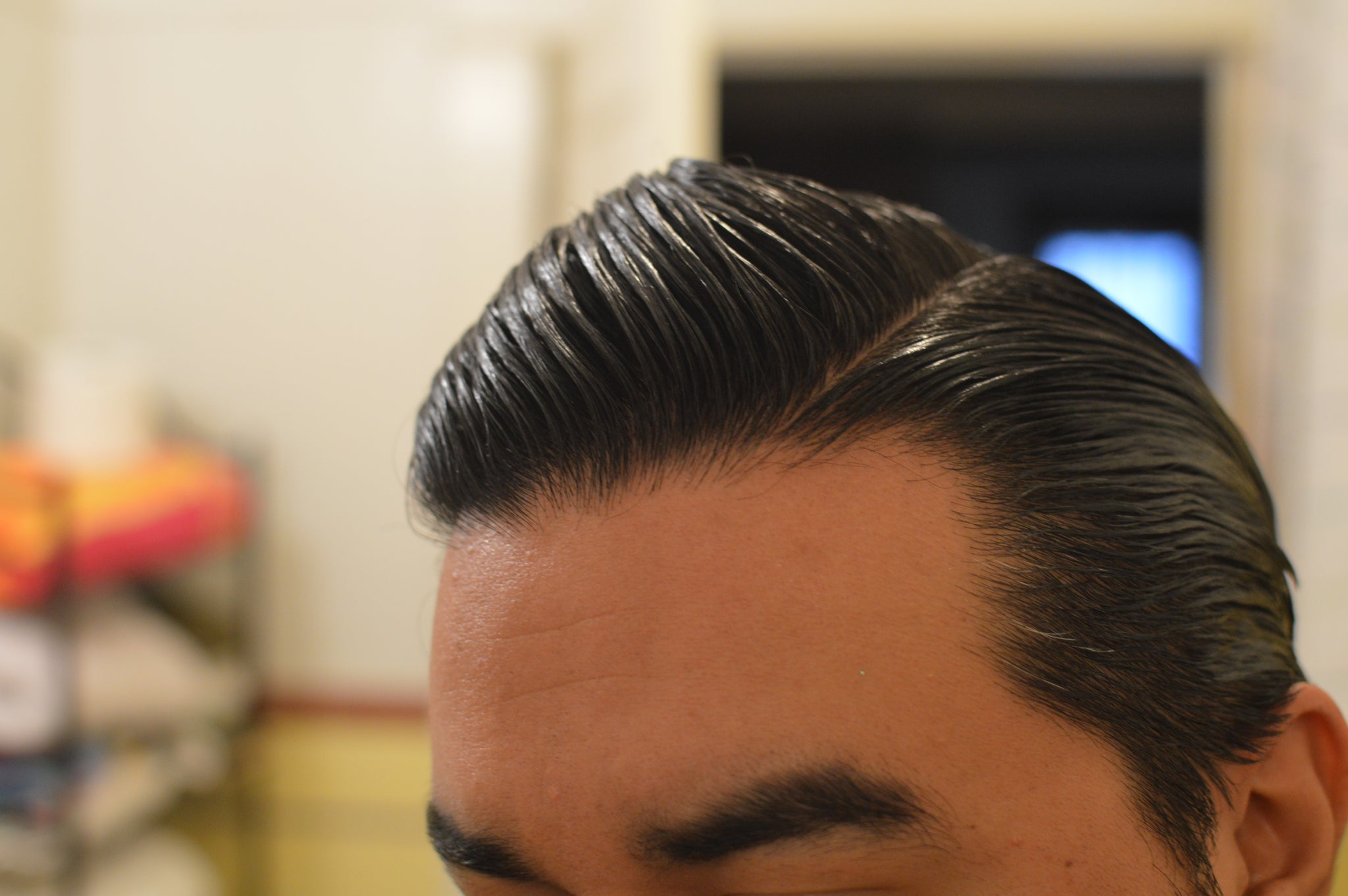 Side view of slick hair