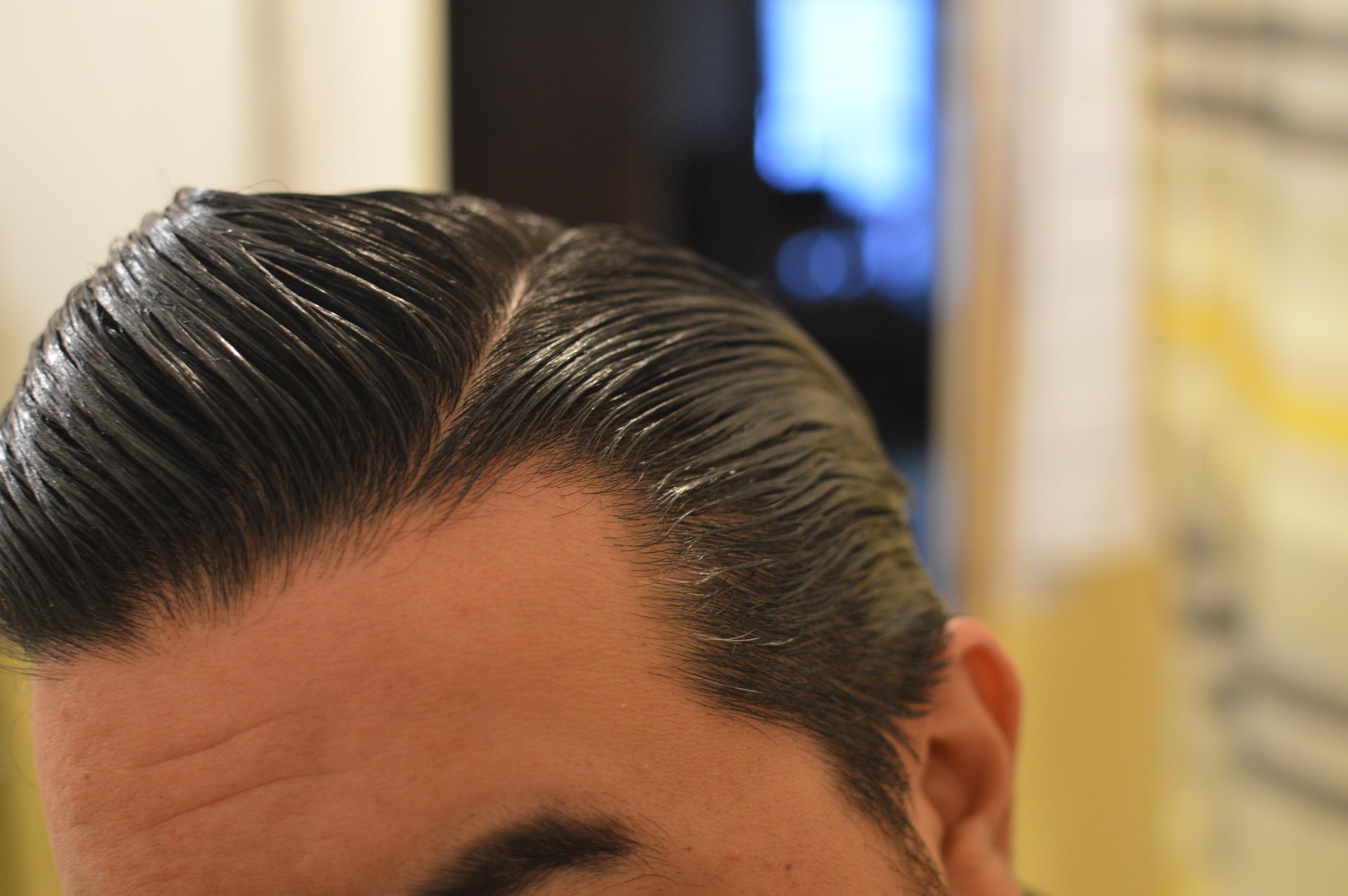 Top side view of Prospectors Pomade side part 