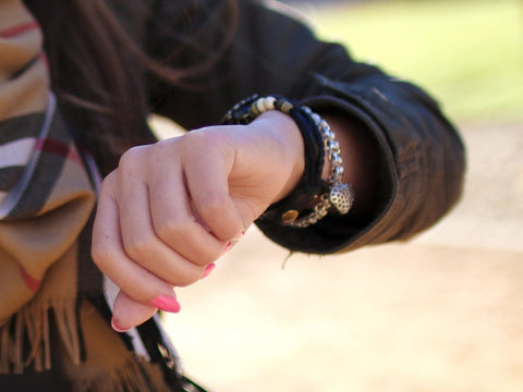 woman wearing a watch and bracelets