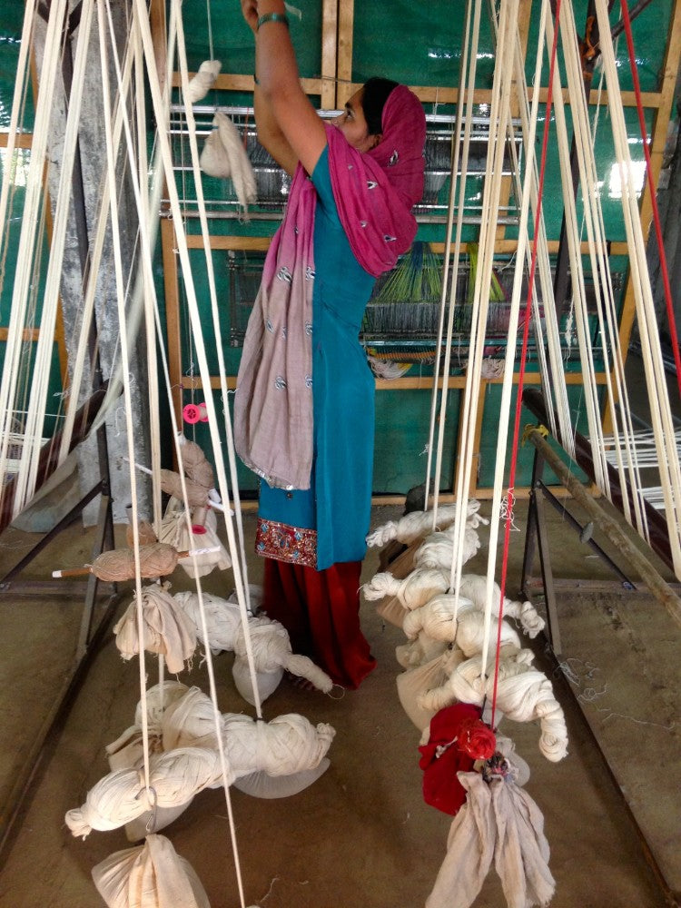 weights and yarns on the hand loom in central india