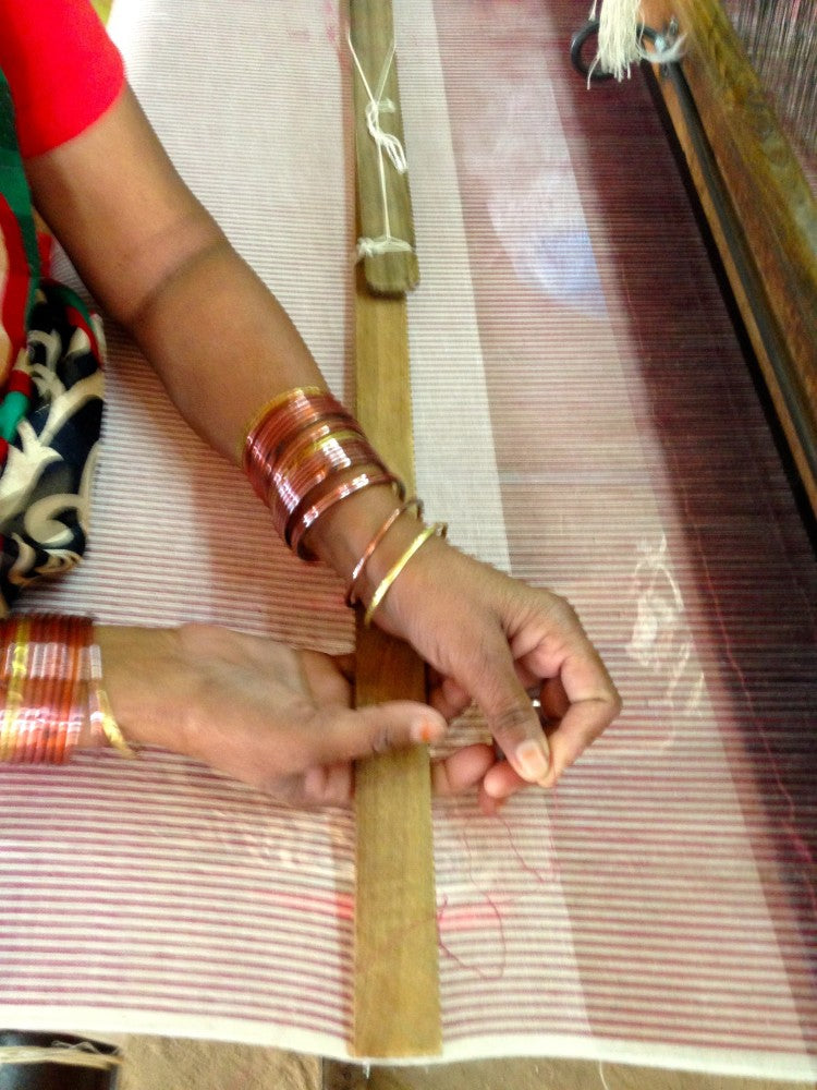 shuttle on handloom in india weaving cotton textiles