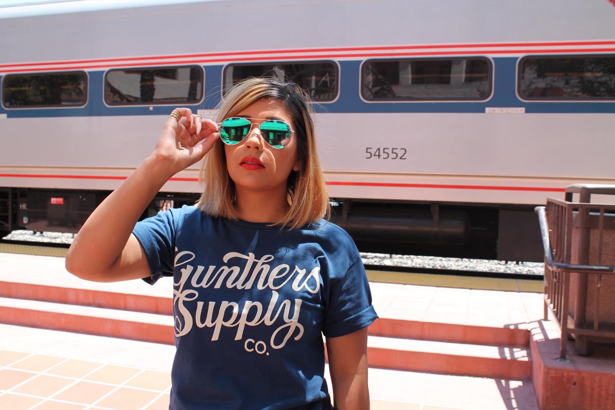 posing-in-front-of-the-train-wearing-gunthers-shirt-and-green-sunglasses