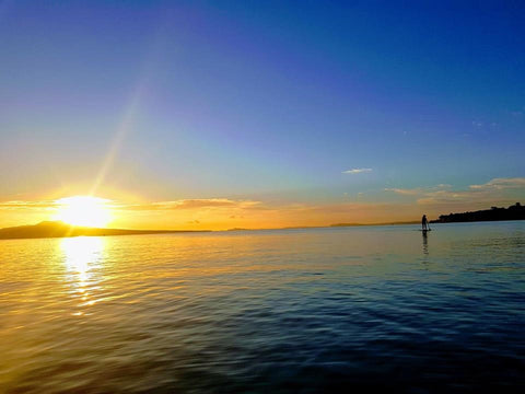 SUP paddling during sunset