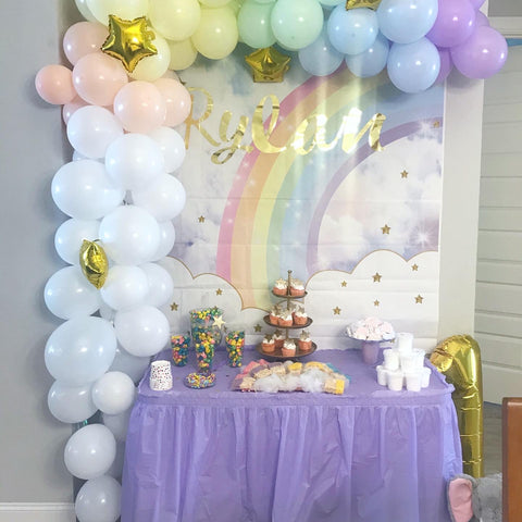 balloon arch with dessert table