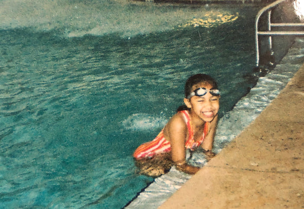 Childhood photo of Bri Miller swimming in a pool