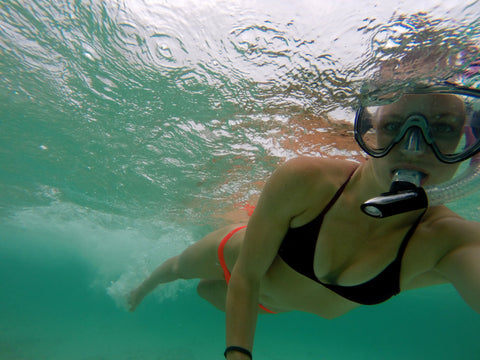 woman in a JOLYN bikini snorkeling