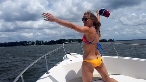 woman wearing a JOLYN bikini on a boat