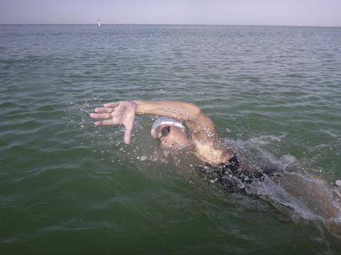 woman surfing wearing a Jolyn surf bikini