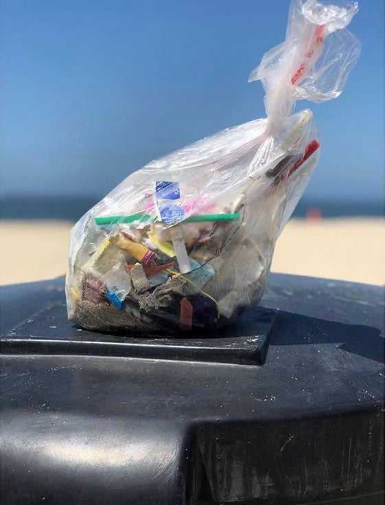 small bag of trash from beach cleanup 