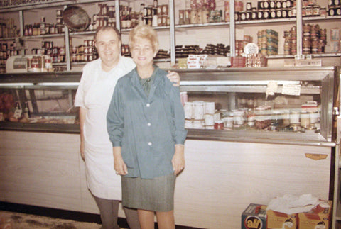 Moe and Shirley in front of the deli counter