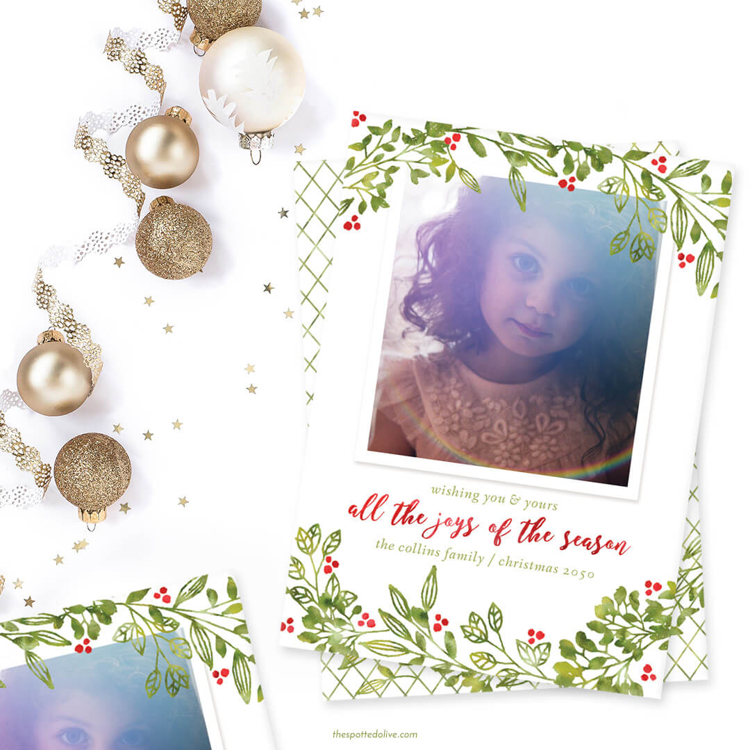 Personalized Holiday Photo Card on white surface with white and gold ornaments and little gold stars