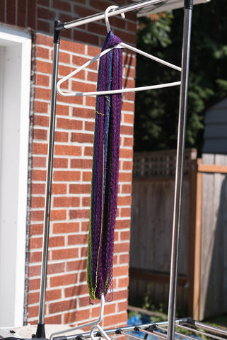 yarn hanging from a clothes hanger