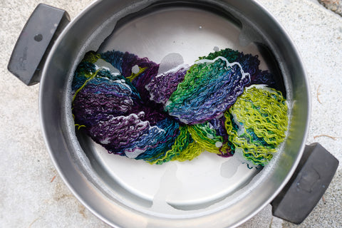 yarn soaking in a pot of water