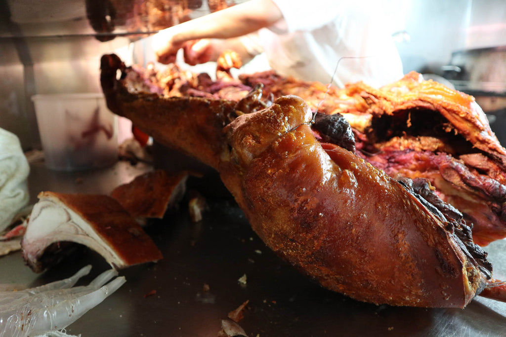 the crackling sound from the roasted pig being cut makes my mouth water