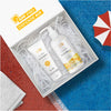  The Beauty Sailor SPF Pro Defense Kit with SPF products in a box, towel and umbrella on the side.