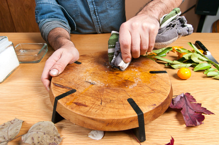 cutting board being cleaned and oiled