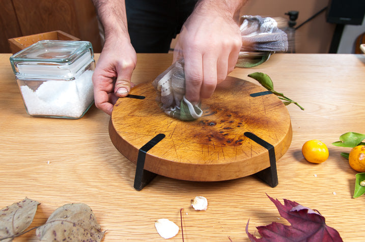 cutting board being cleaned and oiled