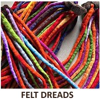 A mixture of four different coloured felt dreadlocks hair scrunchies with the words Felt Dreads beneath