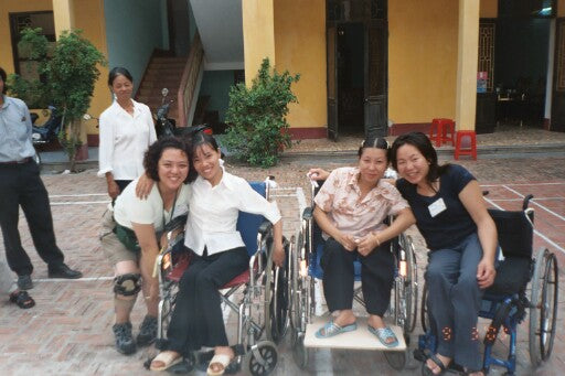 Diane with her two new friends in Vietnam, 2003.