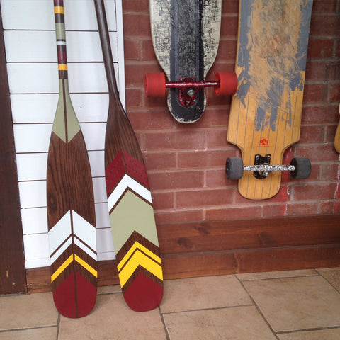 custom painted paddles in entryway