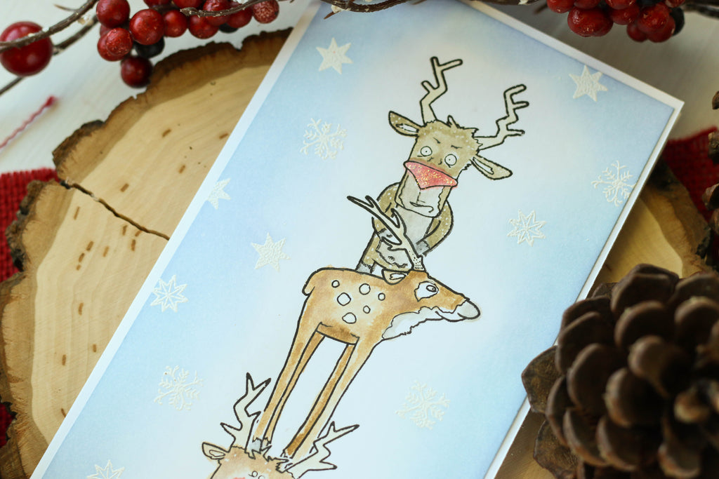 Brutus Monroe's reindeer stamps on this long and skinny card! Lots of masking and coloring went into creating this fun Christmas scene!