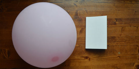 One Day Soon Time Will Have No Place Left to Hide by Christian Kiefer (Nouvella Books) and a pink balloon