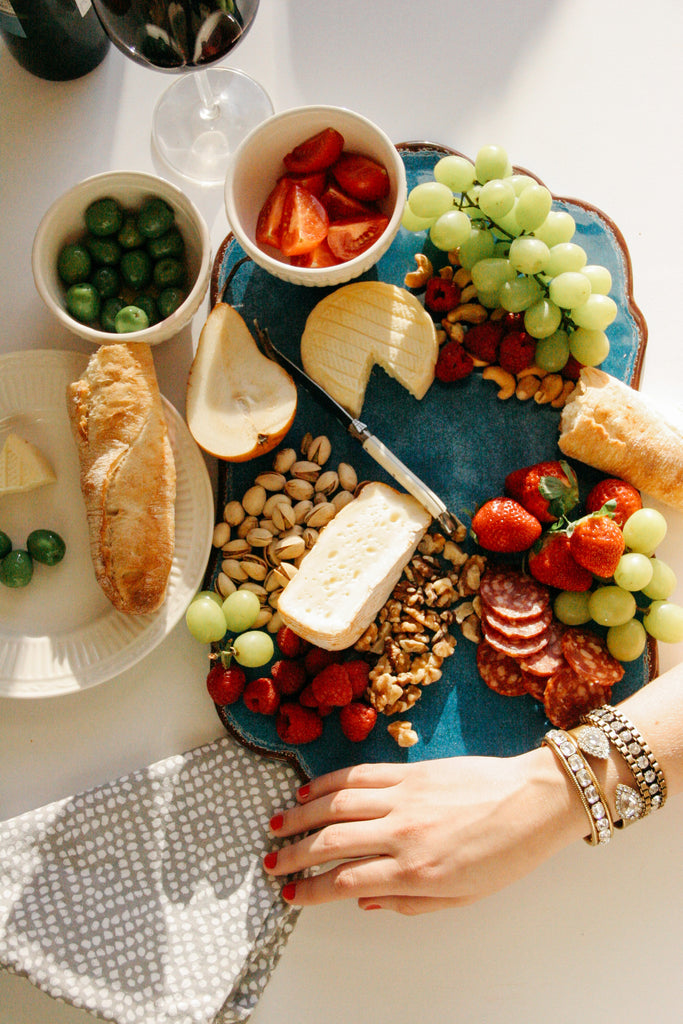 Cheese, Fruit, Charcuterie, Bracelet, Wine, Camembert, Nuts, Pistachio, Grape, Strawberry, Cheese Board, Baguette, Olives, Castelveltrano, Red Wine, Malbec, Valentine's Day, Cow's Milk, Pear, Cashew, Tomato, Wine glass, Romance, Dinner, Nail Polish