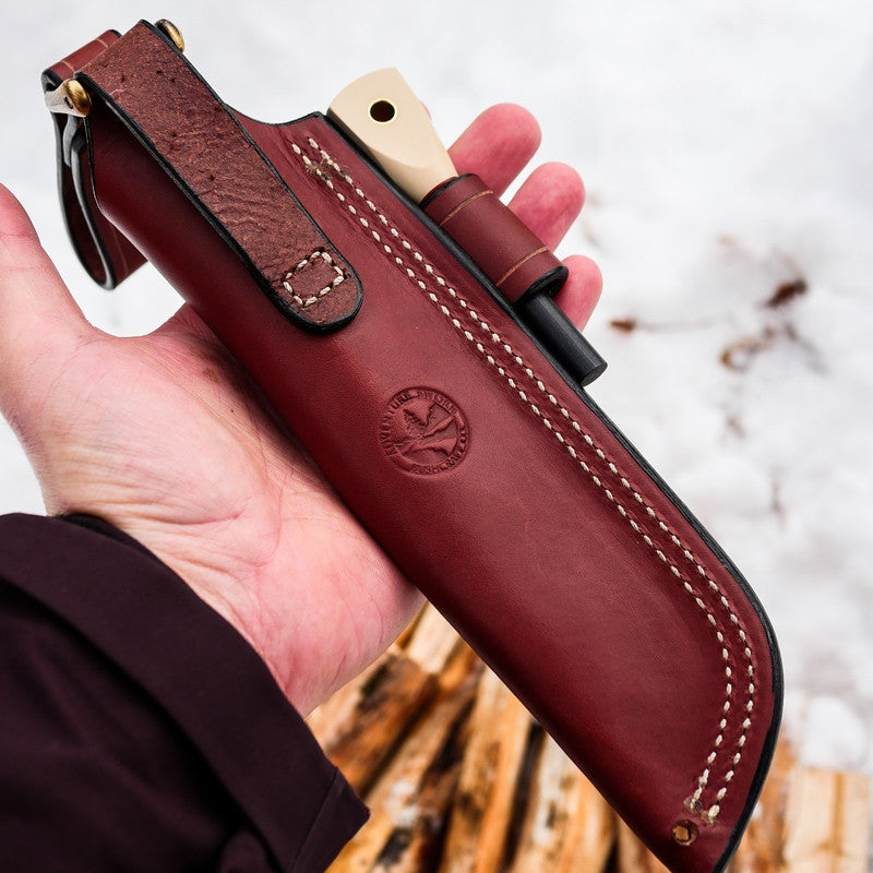 A chestnut brown leather sheath for a Classic bushcraft knife; matching firesteel, firesteel loop, removable dangler
