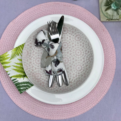 Pink and purple dinner plate setting