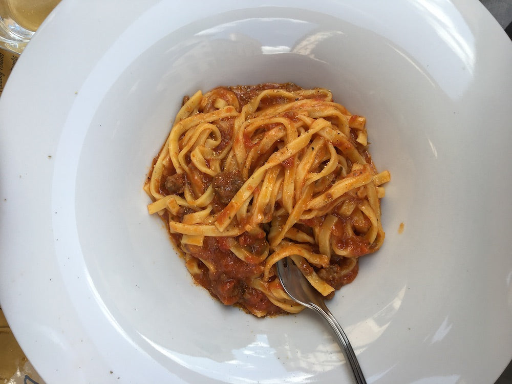 bowl of pasta with red sauce at Solo Vineria e Gastronomica in Rome