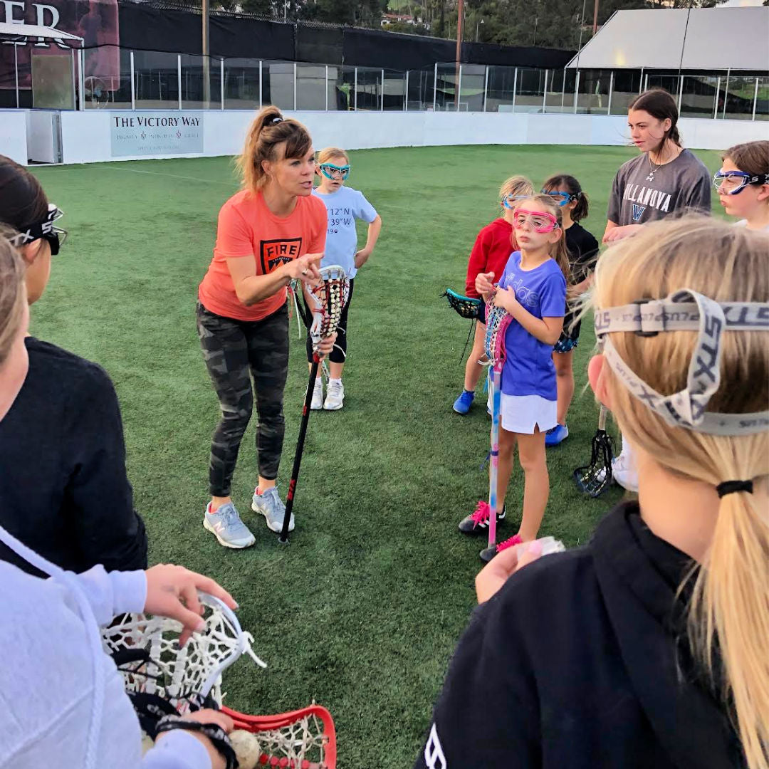 Coach Holly Reilly Renegade Lacrosse - Swax Lax lacrosse training balls - with younger girls