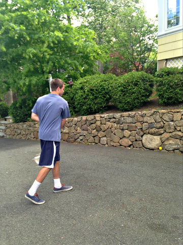 Testing a wet Swax Lax ball by hitting against a stone wall