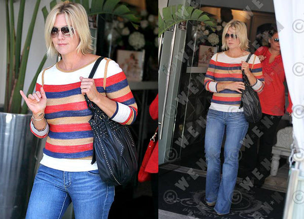 Jennie Garth wearing Elena reversible pullover brighter stripe side.