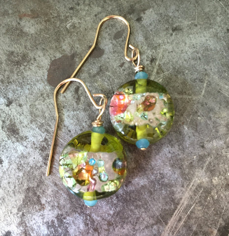 Glass bead earrings, glowing with green and the colors of spring, gold filled wire